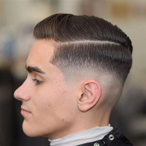 mid taper fade|mid fade with side part.